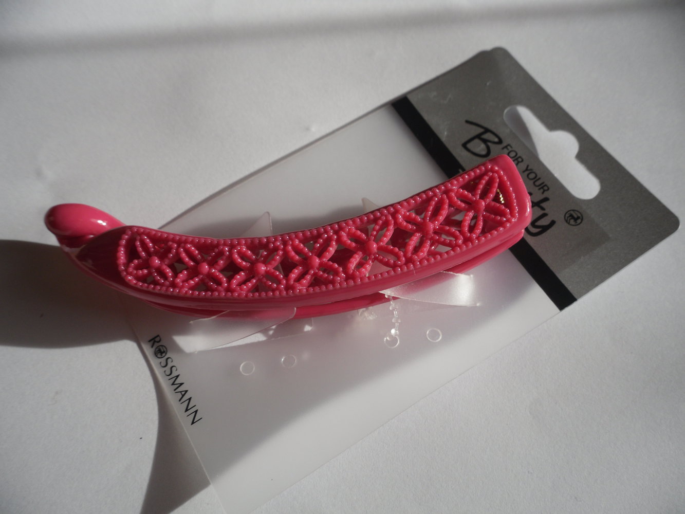 Pinkfarbene Haarklemme mit Blümchenmuster