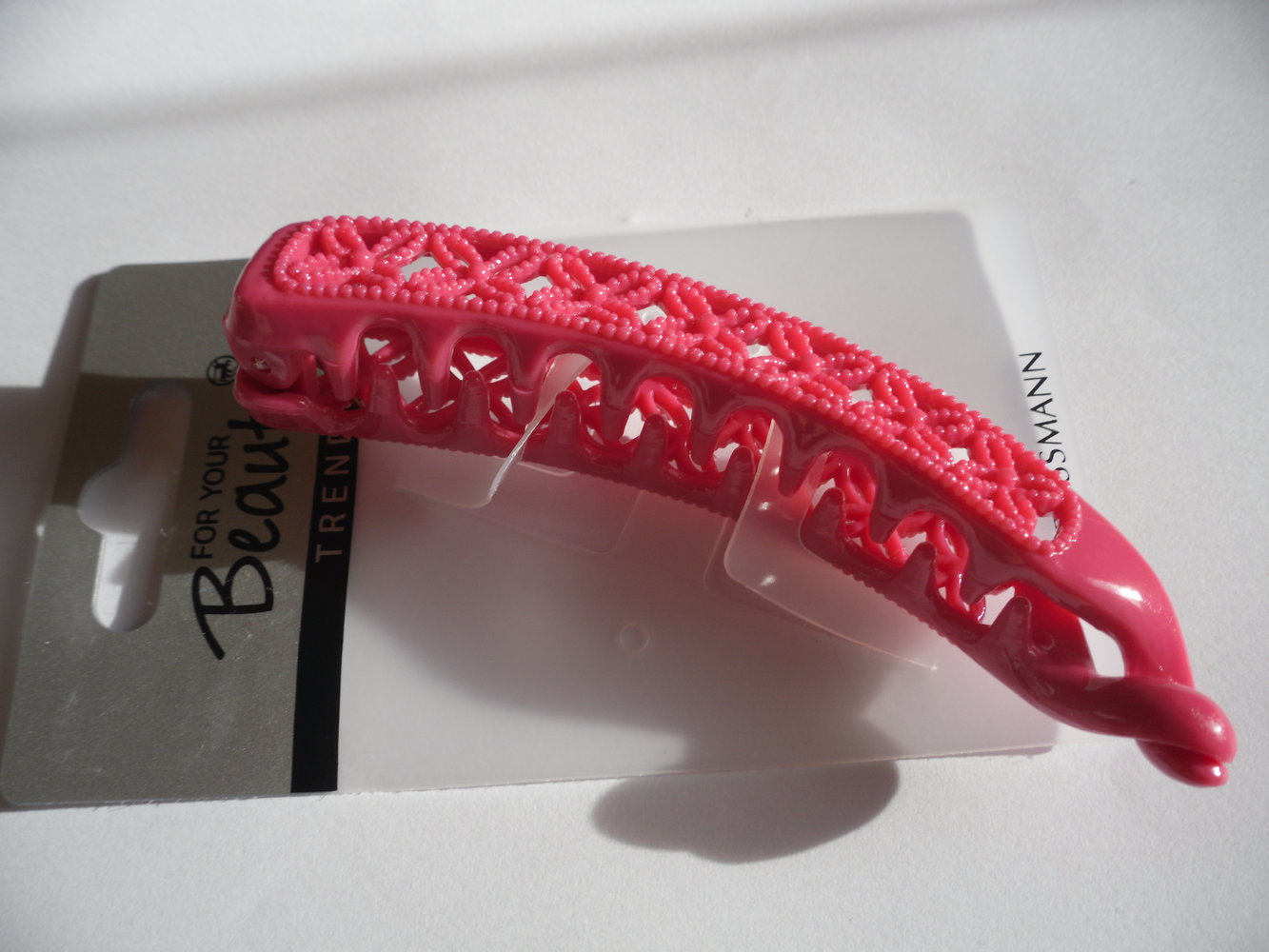 Pinkfarbene Haarklemme mit Blümchenmuster