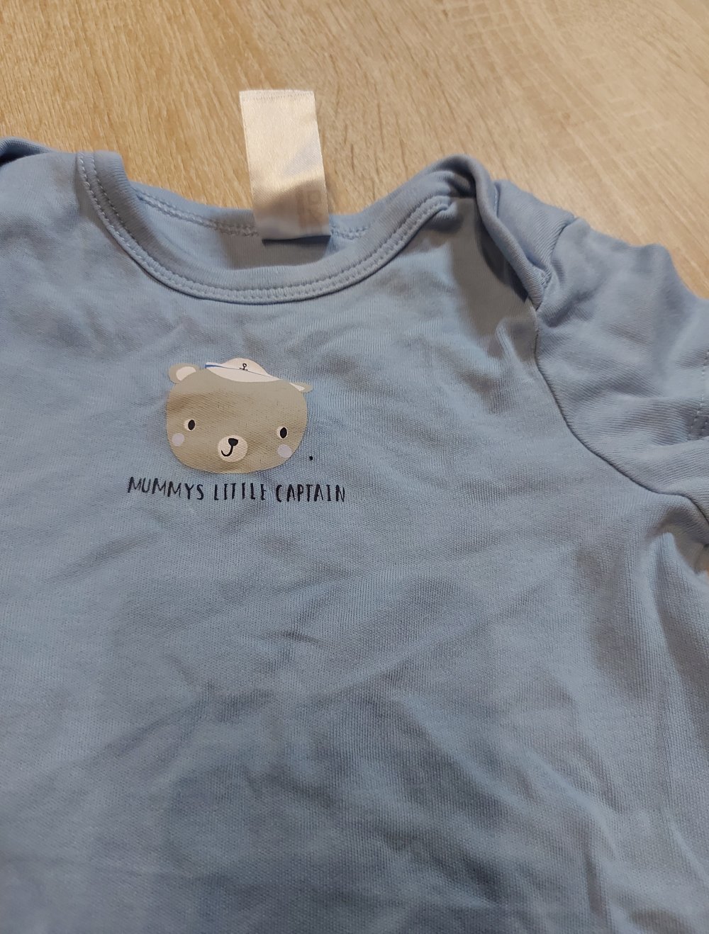 Hellblauer Kurzarmbody Baby Club Größe 74