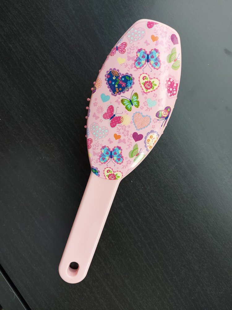 rosa Haarbürste mit Schmetterlingen und Herzen