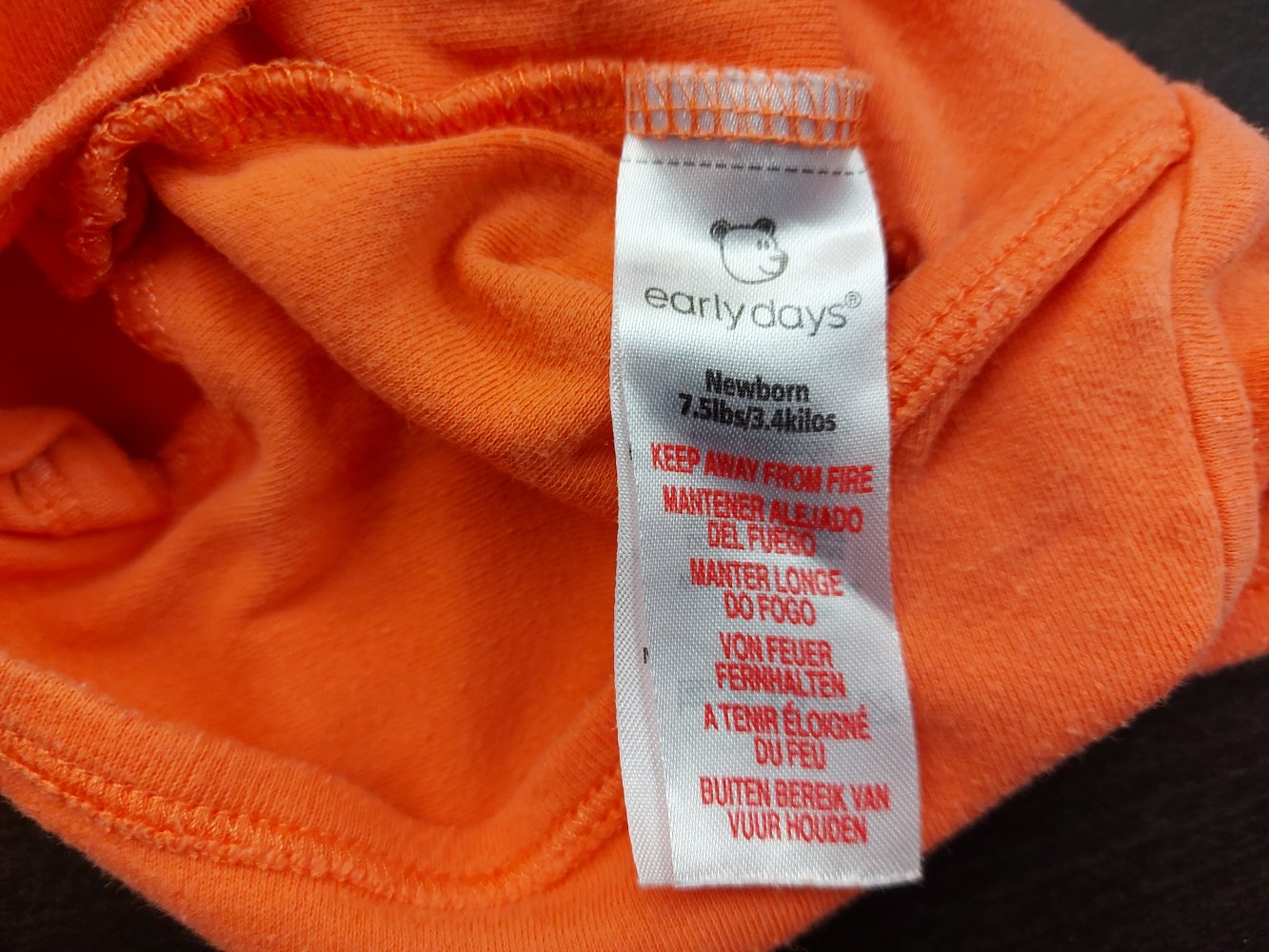 Orangefarbener Kurzarmbody Little cutie Gr. 50/56